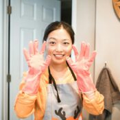 A house maid smiling and posing for the photo.