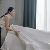 An Asian house help doing cleaning.