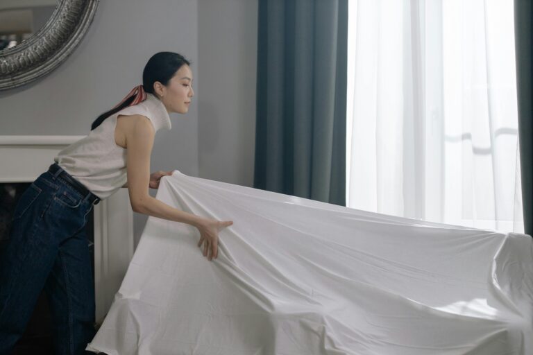 An Asian house help doing cleaning.
